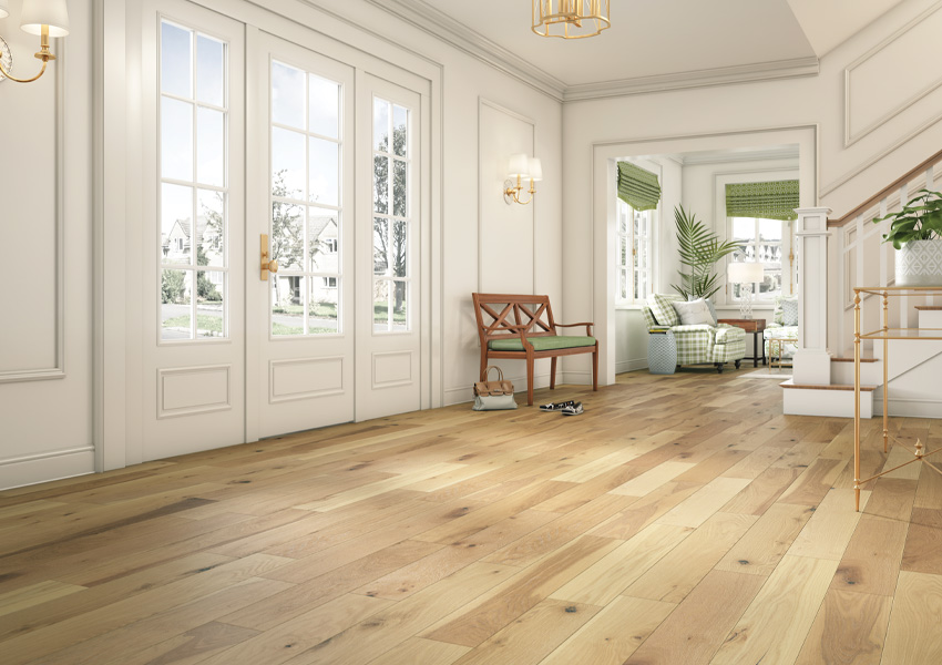 hardwood flooring in entryway with green decor and wood bench